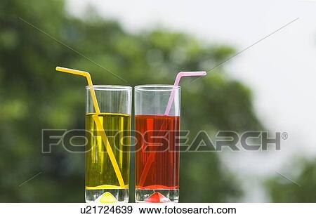 Close-up of two glasses of mocktail View Large Photo Image Stock Photo - Close-up of two glasses of mocktail. Fotosearch