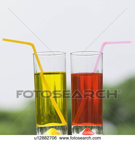 Close-up of two glasses of mocktail View Large Photo Image Stock Photograph - Close-up of two glasses of mocktail. Fotosearch