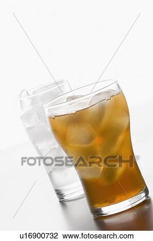 Stock Image - Close-up of a glass of lemonade with ice cubes. Fotosearch