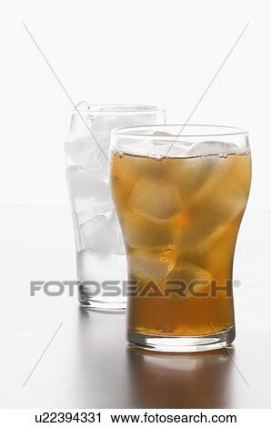 Stock Image - Close-up of a glass of lemonade with ice cubes. Fotosearch