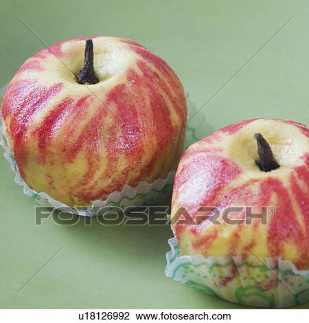 Stock Image - Close-up of apple shape burfi. Fotosearch