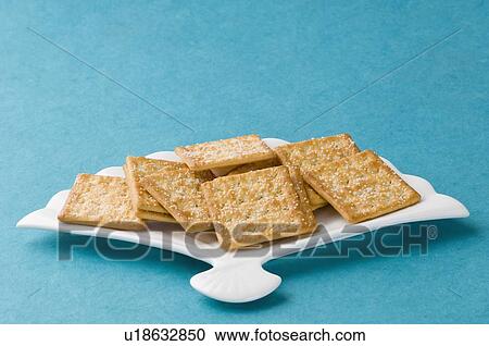 Stock Image - Close-up of biscuits in a tray. Fotosearch