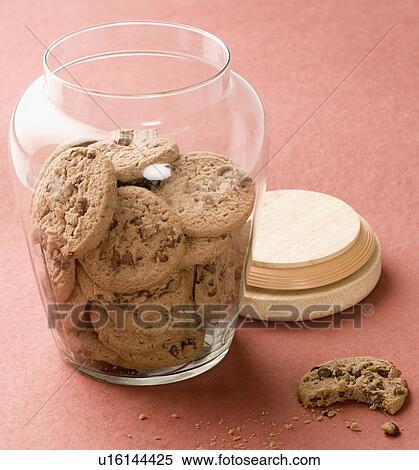 Close-up of brown biscuits in an open jar View Large Photo Image Stock Photography - Close-up of brown biscuits in an open jar. Fotosearch