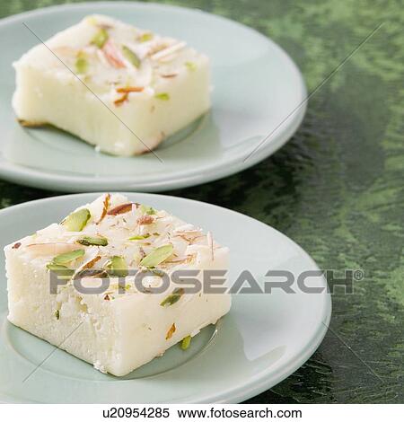 Stock Photography - Close-up of Burfi in saucers. Fotosearch