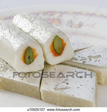 Stock Photo - Close-up of Kaju roll with Kaju Katli. Fotosearch