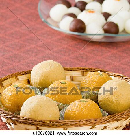 Close-up of Ladoos in a basket View Large Photo Image Stock Image - Close-up of Ladoos in a basket. Fotosearch