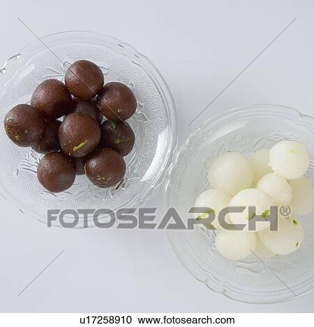 Close-up of Rasgullas and Gulab Jamuns in two bowls View Large Photo Image Stock Image - Close-up of Rasgullas and Gulab Jamuns in two bowls. Fotosearch