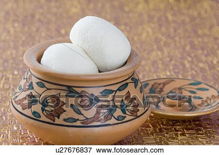 Stock Photo - Close-up of sponge Rasgullas in a bowl. Fotosearch