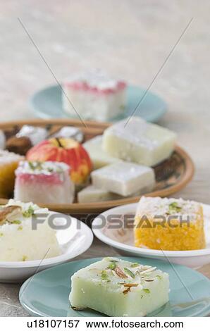 Stock Photo - Close-up of sweets in plate and saucer. Fotosearch