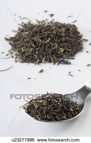Stock Photograph - Close-up of tea leaves in a spoon. Fotosearch