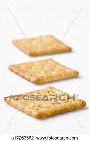 Close-up of three biscuits in a row View Large Photo Image Stock Image - Close-up of three biscuits in a row. Fotosearch