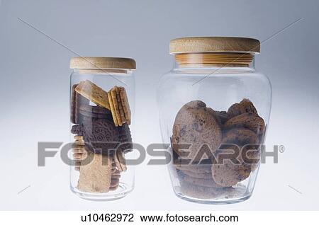 Stock Image - Close-up of two jars of biscuit. Fotosearch