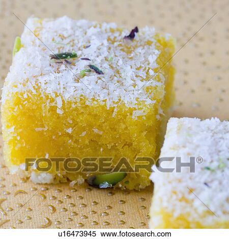 Stock Photography - Close-up of two Moong Daal Burfis. Fotosearch