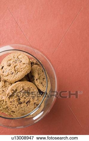 High angle view of brown biscuits in an open jar View Large Photo Image Stock Photo - High angle view of brown biscuits in an open jar. Fotosearch