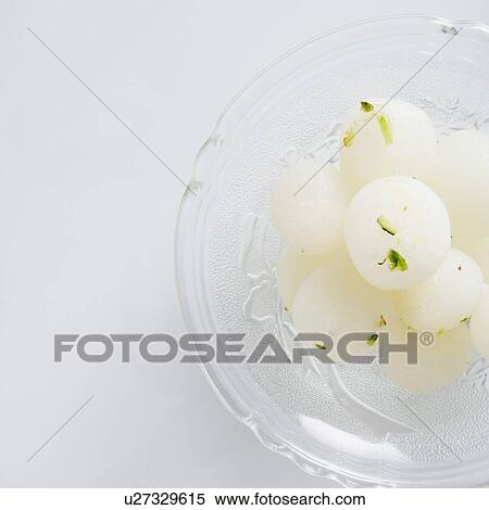 Stock Photography - High angle view of Rasgullas in a bowl. Fotosearch