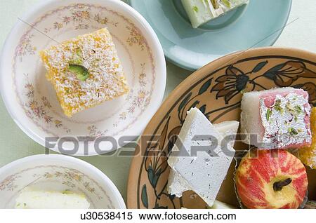 Stock Photography - High angle view of sweets in plate and saucer. Fotosearch