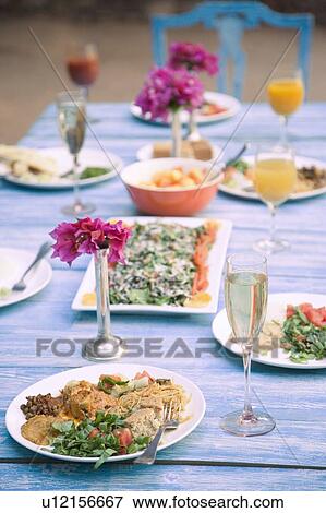 Food served on a dining table View Large Photo Image Stock Photo - Food served on a dining table. Fotosearch