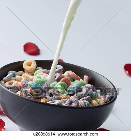 Close-up of a bowl of cereal with milk pouring View Large Photo Image Picture - Close-up of a bowl of cereal with milk pouring. Fotosearch