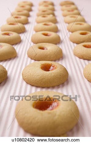 Stock Image - Close-up of biscuits in a row. Fotosearch