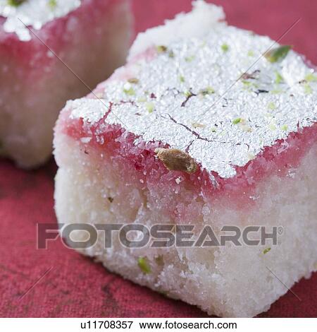 Stock Photo - Close-up of Burfi garnished with Pistachio. Fotosearch