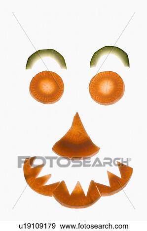 Close-up of carrot and cucumber slices arranged in a shape of smiley face View Large Photo Image Stock Photo - Close-up of carrot and cucumber slices arranged in a shape of smiley face. Fotosearch