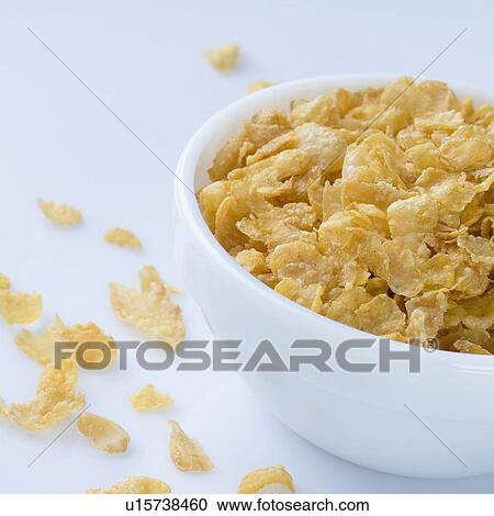 Close-up of corn flakes in a bowl View Large Photo Image Stock Image - Close-up of corn flakes in a bowl. Fotosearch