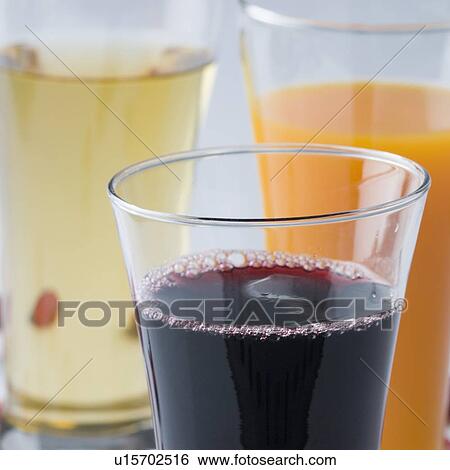 Stock Photograph - Close-up of glasses full with liquid. Fotosearch