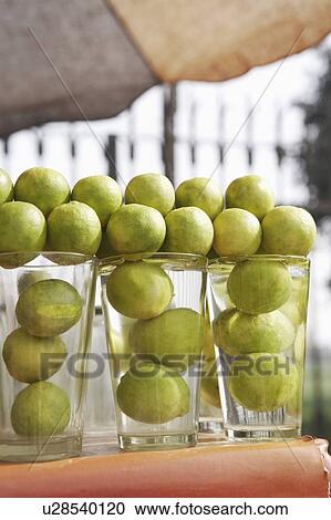 Close-up of lemons in glasses on the table View Large Photo Image Stock Image - Close-up of lemons in glasses on the table. Fotosearch