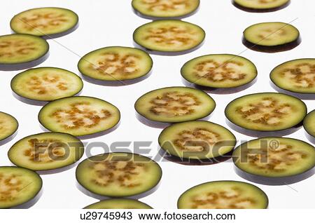 Stock Image - Close-up of slices of eggplants. Fotosearch