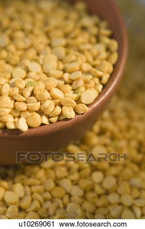 Close-up of Split Bengal grams in a bowl View Large Photo Image Stock Image - Close-up of Split Bengal grams in a bowl. Fotosearch