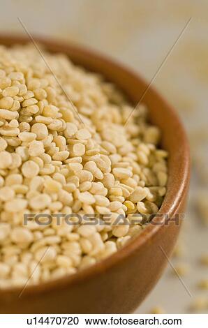 Stock Image - Close-up of Split Green grams in a bowl. Fotosearch
