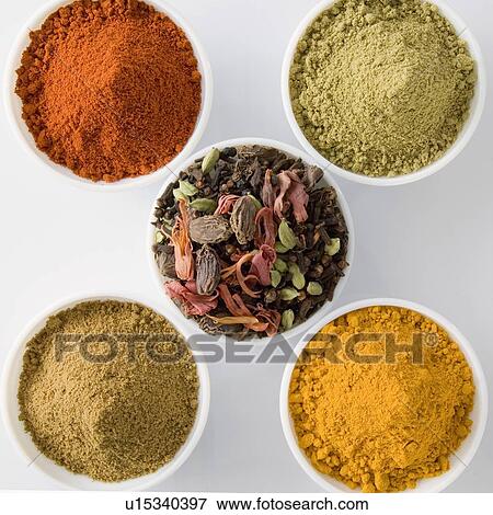 Stock Photo - High angle view of five bowls of spices. Fotosearch