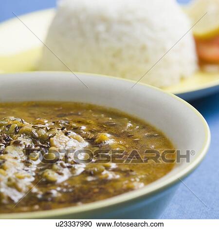 Close-up of a bowl of curry with white rice on a plate View Large Photo Image Stock Image - Close-up of a bowl of curry with white rice on a plate. Fotosearch