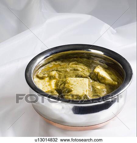Close-up of a bowl of palak paneer View Large Photo Image Stock Image - Close-up of a bowl of palak paneer. Fotosearch