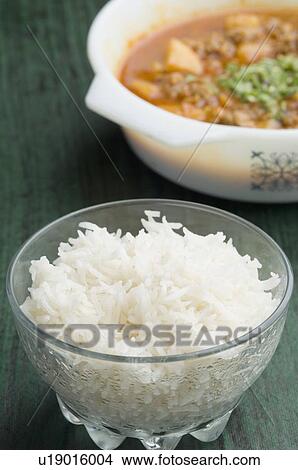Close-up of a bowl of white rice and a bowl of curry View Large Photo Image Picture - Close-up of a bowl of white rice and a bowl of curry. Fotosearch