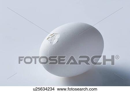 Picture - Close-up of a broken egg. Fotosearch