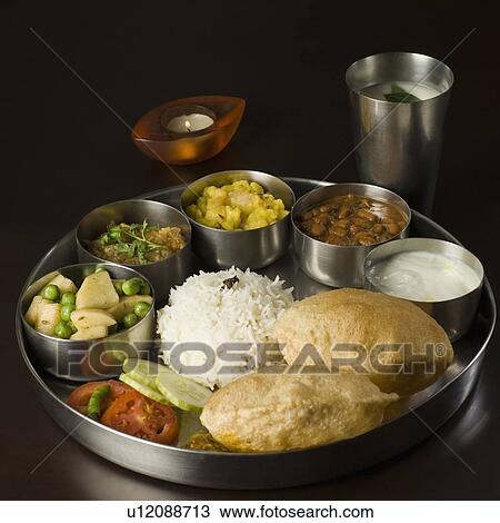 Stock Image - Close-up of assorted Indian food. Fotosearch