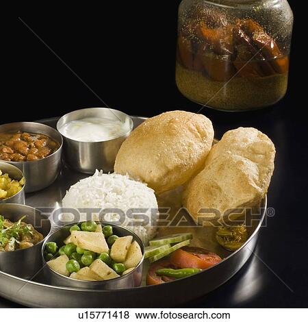 Close-up of assorted Indian food View Large Photo Image Stock Photo - Close-up of assorted Indian food. Fotosearch