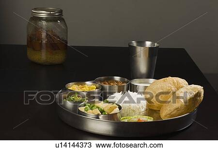 Stock Image - Close-up of assorted Indian foods. Fotosearch