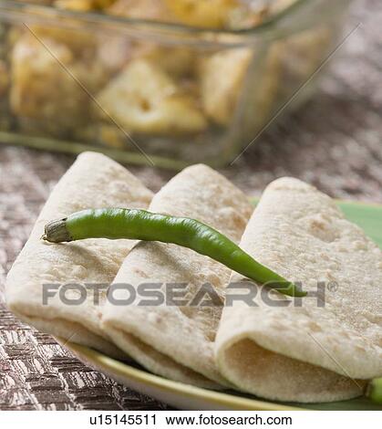 Close-up of chapattis in a plate View Large Photo Image Stock Image - Close-up of chapattis in a plate. Fotosearch