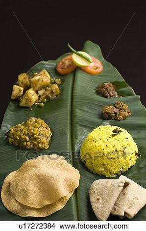 Picture - Close-up of Indian food on a banana leaf. Fotosearch