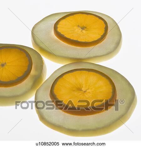 Close-up of slices of cantaloupe and orange View Large Photo Image Stock Photography - Close-up of slices of cantaloupe and orange. Fotosearch