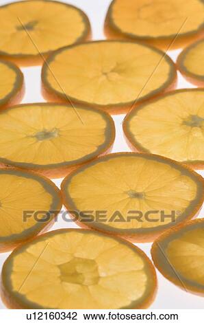 Close-up of slices of oranges View Large Photo Image Stock Image - Close-up of slices of oranges. Fotosearch