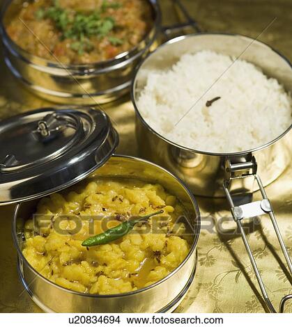 Close-up of tiffin boxes of rice and curry View Large Photo Image Picture - Close-up of tiffin boxes of rice and curry. Fotosearch