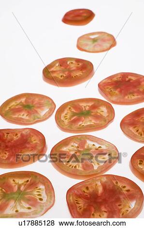 Close-up of tomato slices View Large Photo Image Stock Photo - Close-up of tomato slices. Fotosearch
