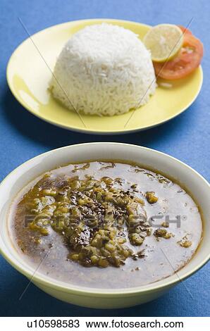 High angle view of a bowl of curry with rice and salad on a plate View Large Photo Image Stock Image - High angle view of a bowl of curry with rice and salad on a plate. Fotosearch