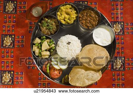 Stock Image - High angle view of assorted Indian food. Fotosearch
