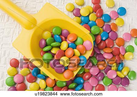 Picture - Assorted candies with a scoop. Fotosearch