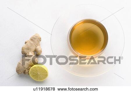 Close-up of a cup of herbal tea with ginger and lemon slice View Large Photo Image Stock Photo - Close-up of a cup of herbal tea with ginger and lemon slice. Fotosearch