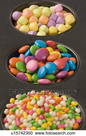 Stock Image - Close-up of candies with jellybeans in a serving tray. Fotosearch